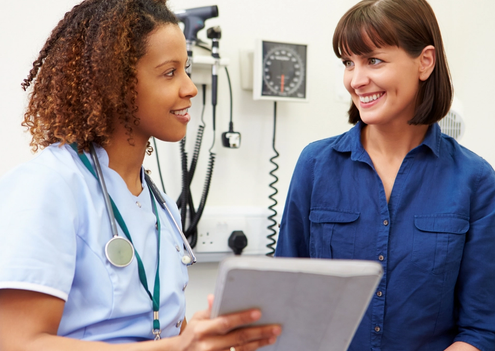 Nurse and Patient Looking at Notepad